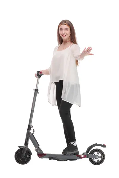 从侧面看女人喜欢在白色背景上骑电动车 健康生活方式的概念 — 图库照片