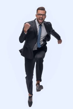 Tam gelişim. Mutlu dans eden genç iş adamı. beyaz arkaplanda izole