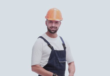in full growth. professional foreman Builder with drawings. isolated on white background clipart