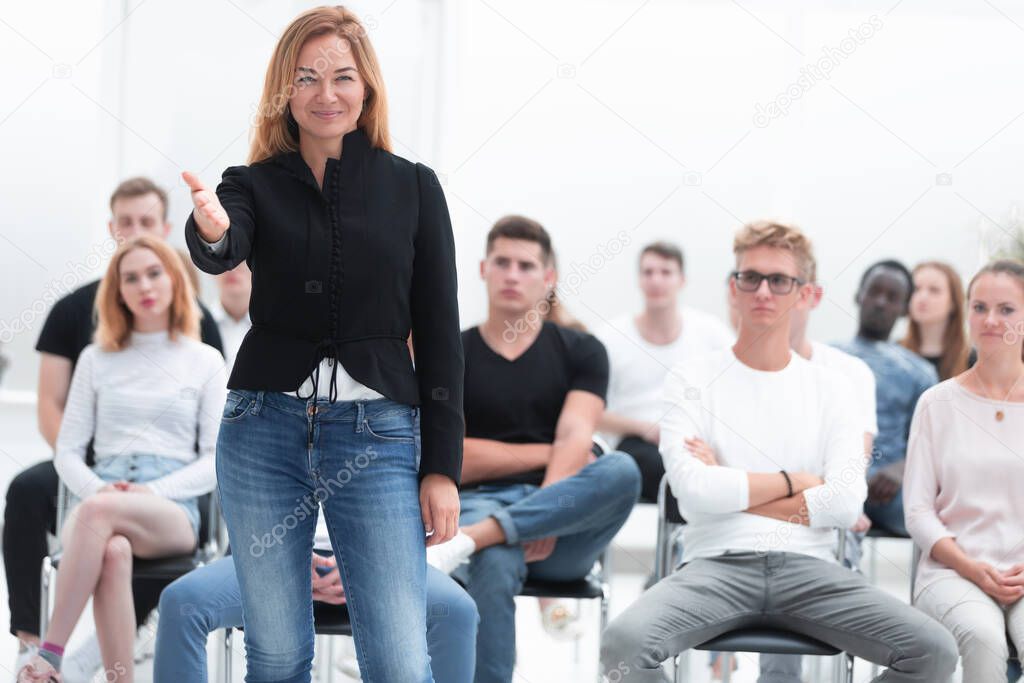 young woman asks a question during a business seminar. business and education