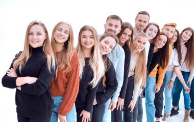 close up. group of cheerful young people standing behind each other clipart