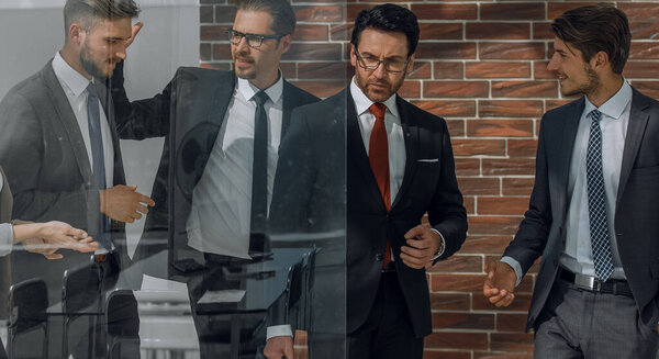 Сфокусированные кавказские бизнесмены встречаются в зале заседаний за стеклом.