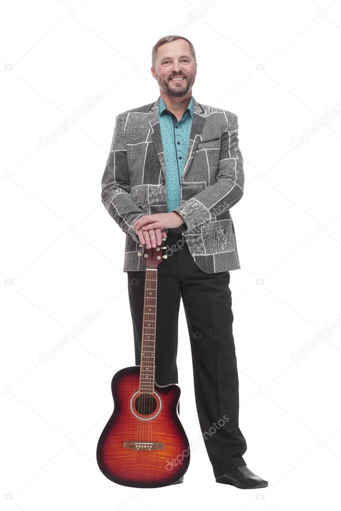 full-length. casual cheerful man with a guitar. isolated on a white background.