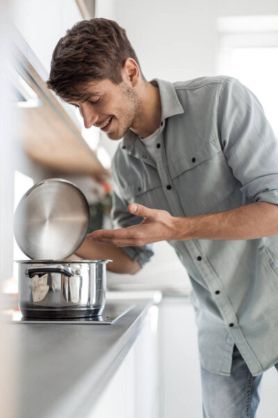 confident young business man pointing at you . photo with copy space