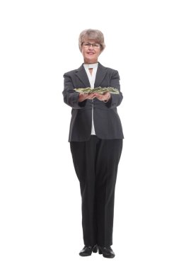 A smiling woman holding dollars with thumb up sign, isolated on white background