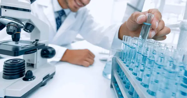 Investigator Checks Test Tubes Blue Liquid — Stock Photo, Image