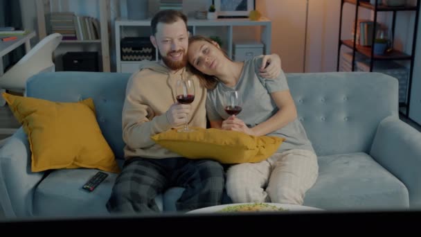 Husband Wife Drinking Red Wine Glasses Talking Watching Film Apartment — Stock Video