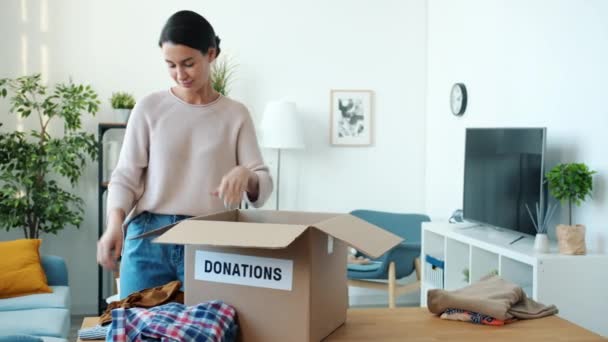 Generous Family Mother Father Daughter Sharing Clothes Toys Packing Boxes — Stock Video