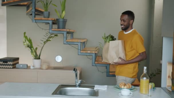 Slow Motion Smiling African American Man Carrying Bag Groceries Walking — Stock Video