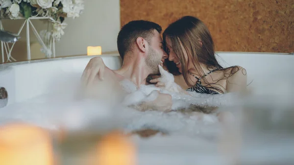 Adorable Cheerful Young Couple Having Fun Bubbling Hot Tub Playing — Stock Photo, Image