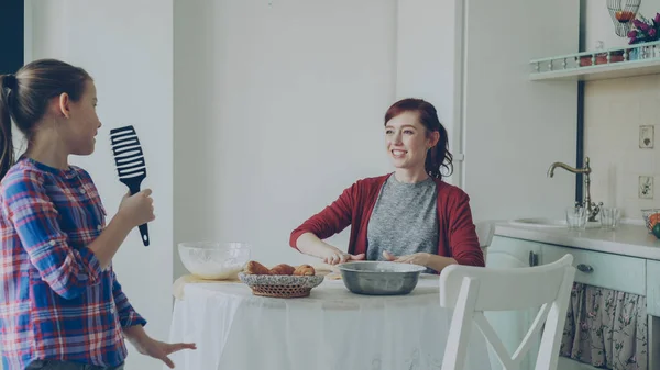 Young Mother Rolling Dough While Cooking Her Little Funny Daughter — Stock Photo, Image