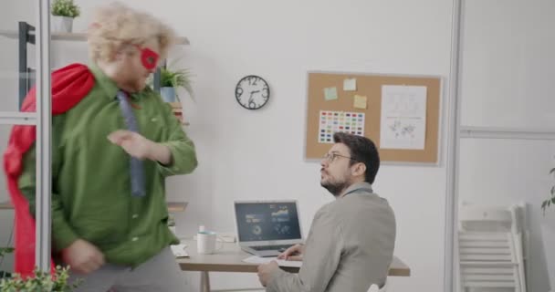 Guy Super Hero Costume Helping Office Workers Routine Responsibilities Running — Stock Video