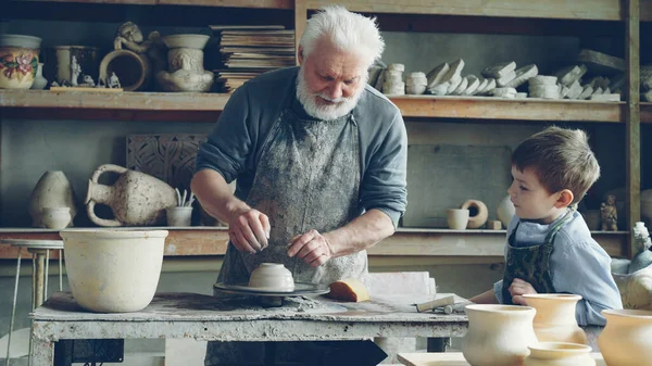 Caring Senior Grandfather Showing Young Cute Grandson How Work Clay — Stock Photo, Image