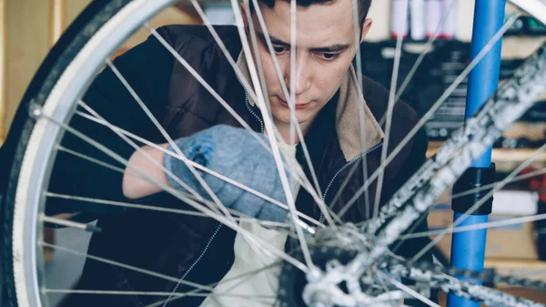 Young Man Experienced Serviceman Fixing Bike Wheel Using Wrench Other — Stock Photo, Image