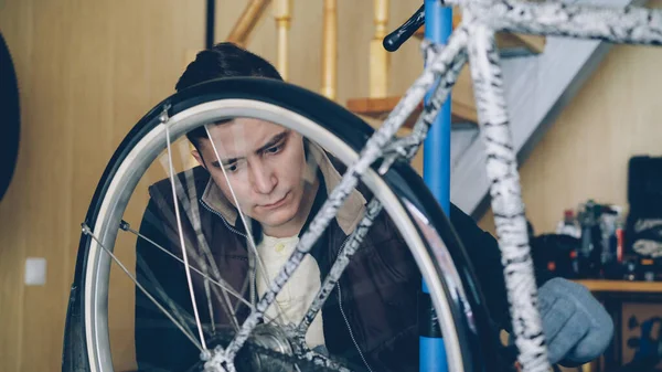 Professional Bike Repairman Busy Fixing Mechanism Bicycle Wheel Rotating Adjusting — Stock Photo, Image