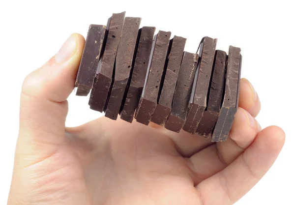 Kawałki czekolady, w ręku — Zdjęcie stockowe