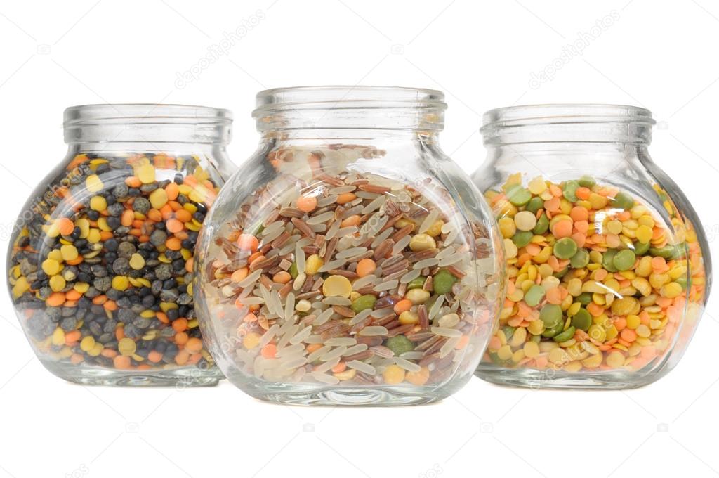 Glass Jars with Assorted Cereals (Lentils, Rice and Split Peas) Isolated on White Background