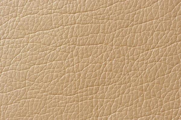 Textura de cuero artificial brillante beige Imagen de stock