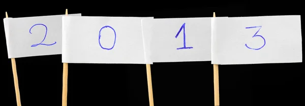 Banderas de papel con número 2013 sobre fondo negro — Foto de Stock