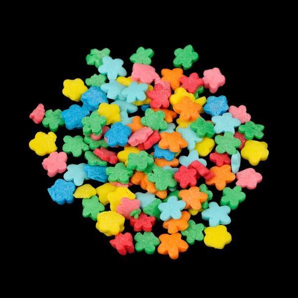 Flower-Shaped Colorful Sugar Sprinkles (Edible Cake Decorations) on Black Background — Stock Photo, Image