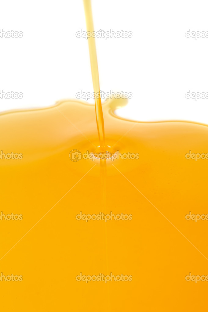 Pouring Honey on White Background