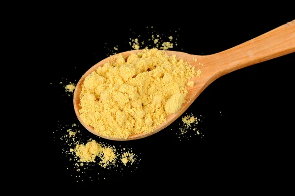 Mustard Powder in Wooden Spoon on Black Background — Stock Photo, Image