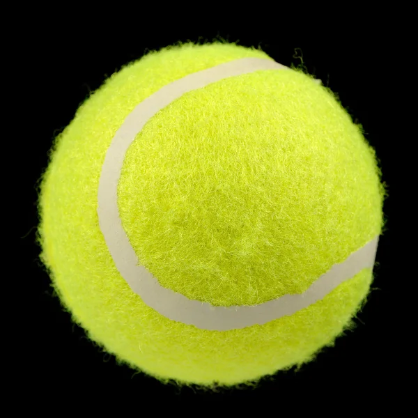 Luminoso prato verde palla da tennis su sfondo nero — Foto Stock