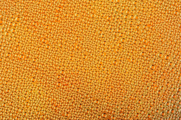 Gotas de agua sobre fondo amarillo — Foto de Stock