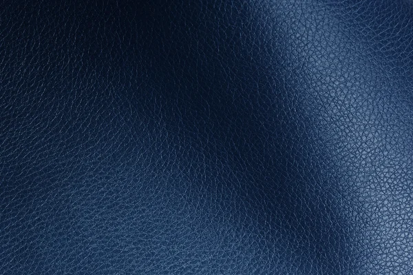 Textura de couro artificial azul escuro com sombras — Fotografia de Stock