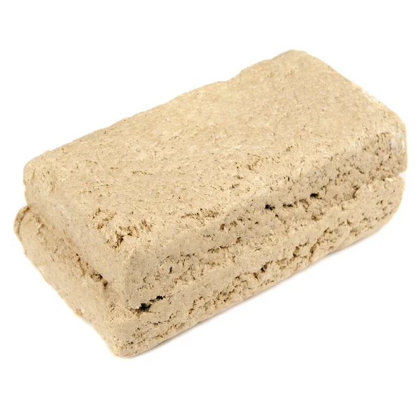 Zonnebloem halva geïsoleerd op witte achtergrond — Stockfoto