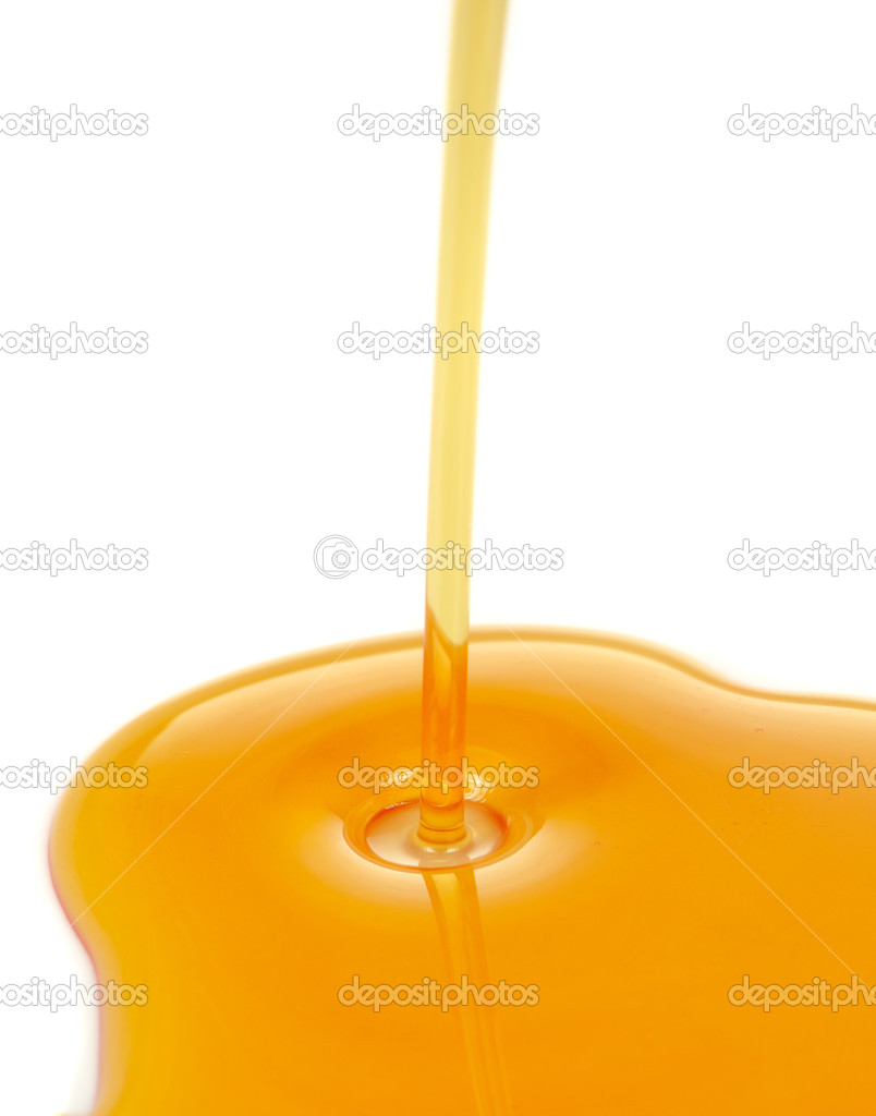 Stream of Pouring Syrup on White Background