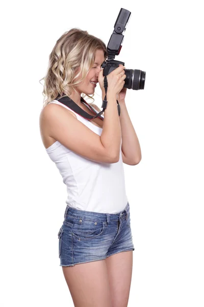 Mujer disparando con una cámara — Foto de Stock