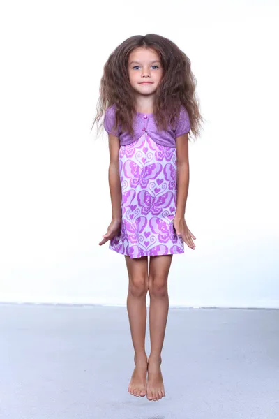 Full-length portrait of a little girl in the studio — Stock Photo, Image