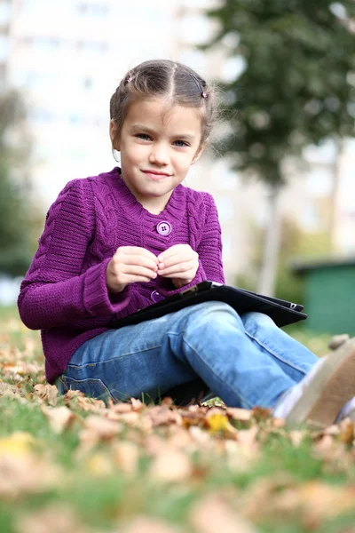 Little Girl holding tablet digital computer — Stock Photo, Image