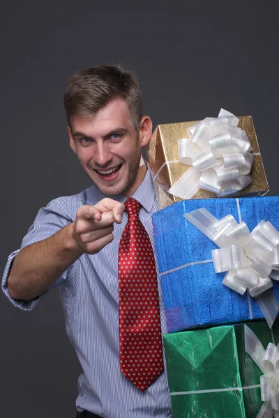 Portrait of young business man with gifts — Stock Photo, Image