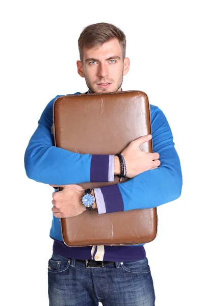 En ung man som bär en resväska — Stockfoto