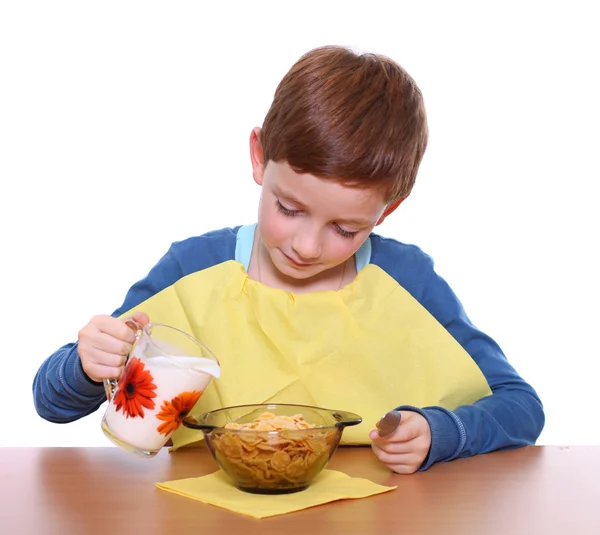 Little boy breakfast isolated over white background — Stock Photo, Image