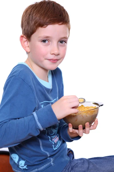 Little boy breakfast isolated over white background — Stock Photo, Image