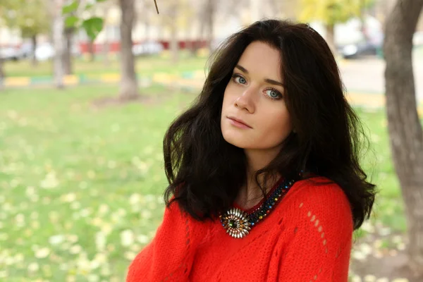 Autumn portrait of a girl in a red sweater — Stock Photo, Image