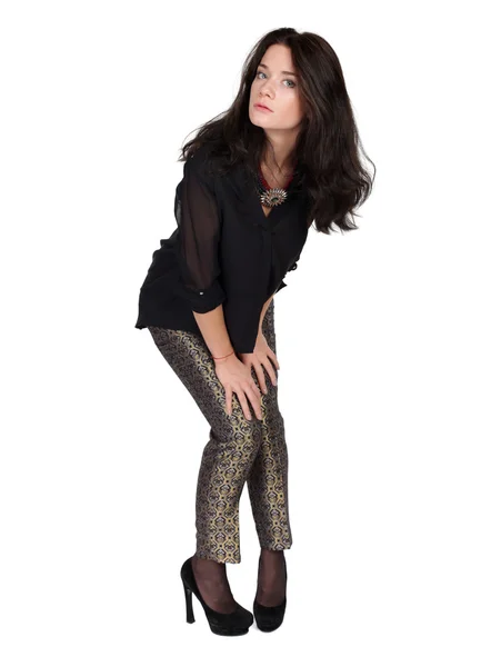 Retrato de moda de uma menina de calças e uma blusa preta — Fotografia de Stock
