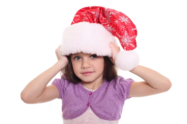 Porträtt av glad liten flicka i santa hatt — Stockfoto