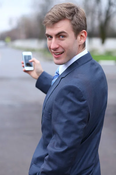 Young attractive man calling by phone — Stock Photo, Image