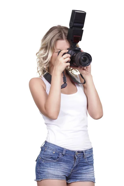 Mujer disparando con una cámara — Foto de Stock