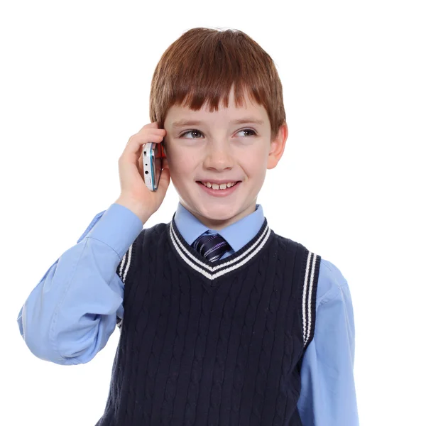 Kleine jongen belt via de telefoon — Stockfoto