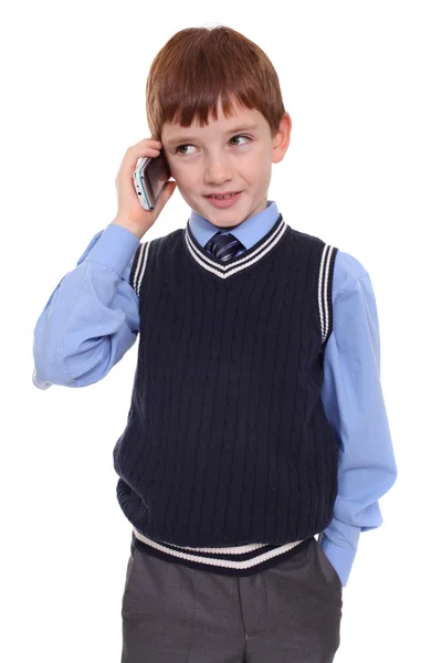 Liten pojke ringer via telefon — Stockfoto