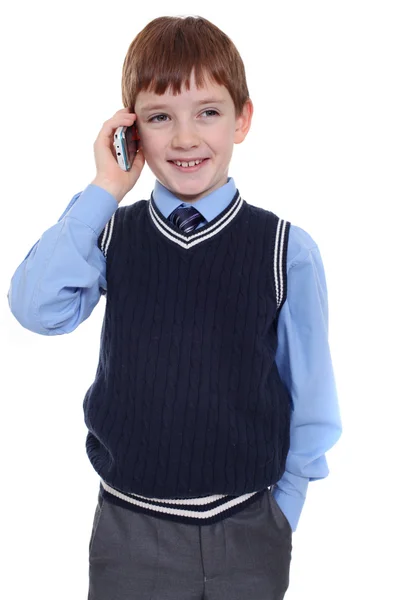 Kleine jongen belt via de telefoon — Stockfoto