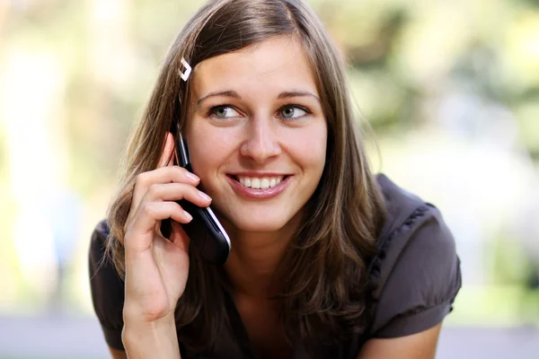 Young woman calling by phone Stock Image