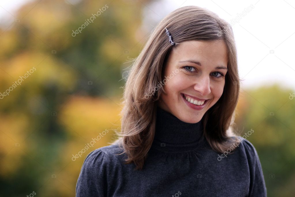 Closeup portrait of a happy young woman smiling