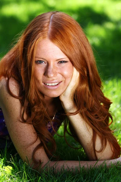 Beautiful redhead woman in a dress — Stock Photo, Image