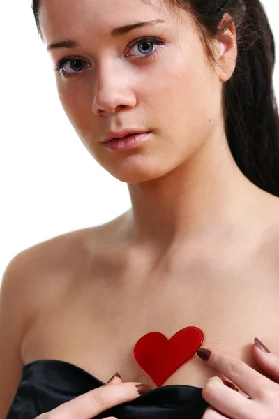 Jovem mulher segurando um coração — Fotografia de Stock